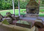 covered outdoor room with fireplace