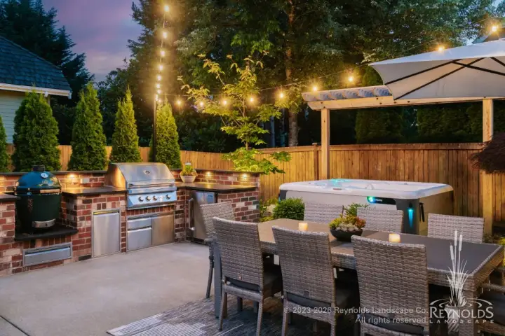 Outdoor kitchen, dining, and hot tub patio.