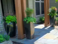 High-gloss glazed ceramic entry planters.