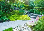 Gas fire pit centered on random flagstone patio.