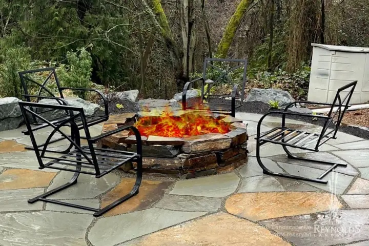 Flagstone patio with fire pit.