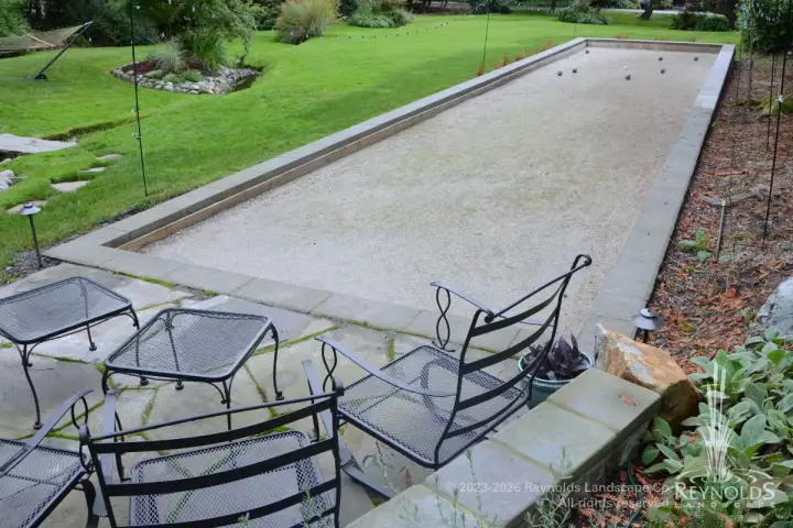 Professional grade bocce ball court with flagstone patio and garden border Medina WA
